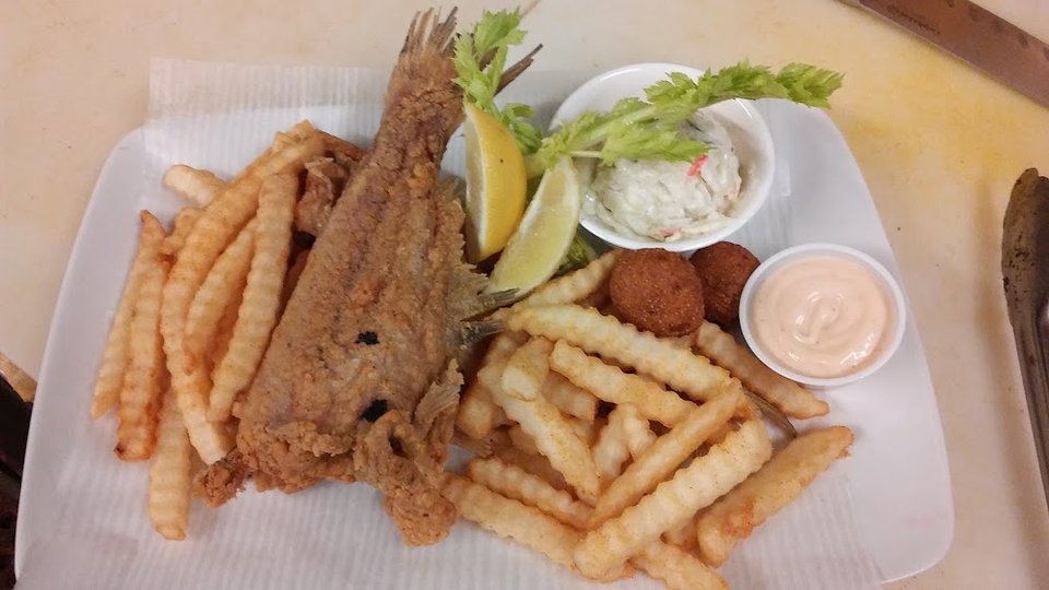Menu page with poboys and crab legs.