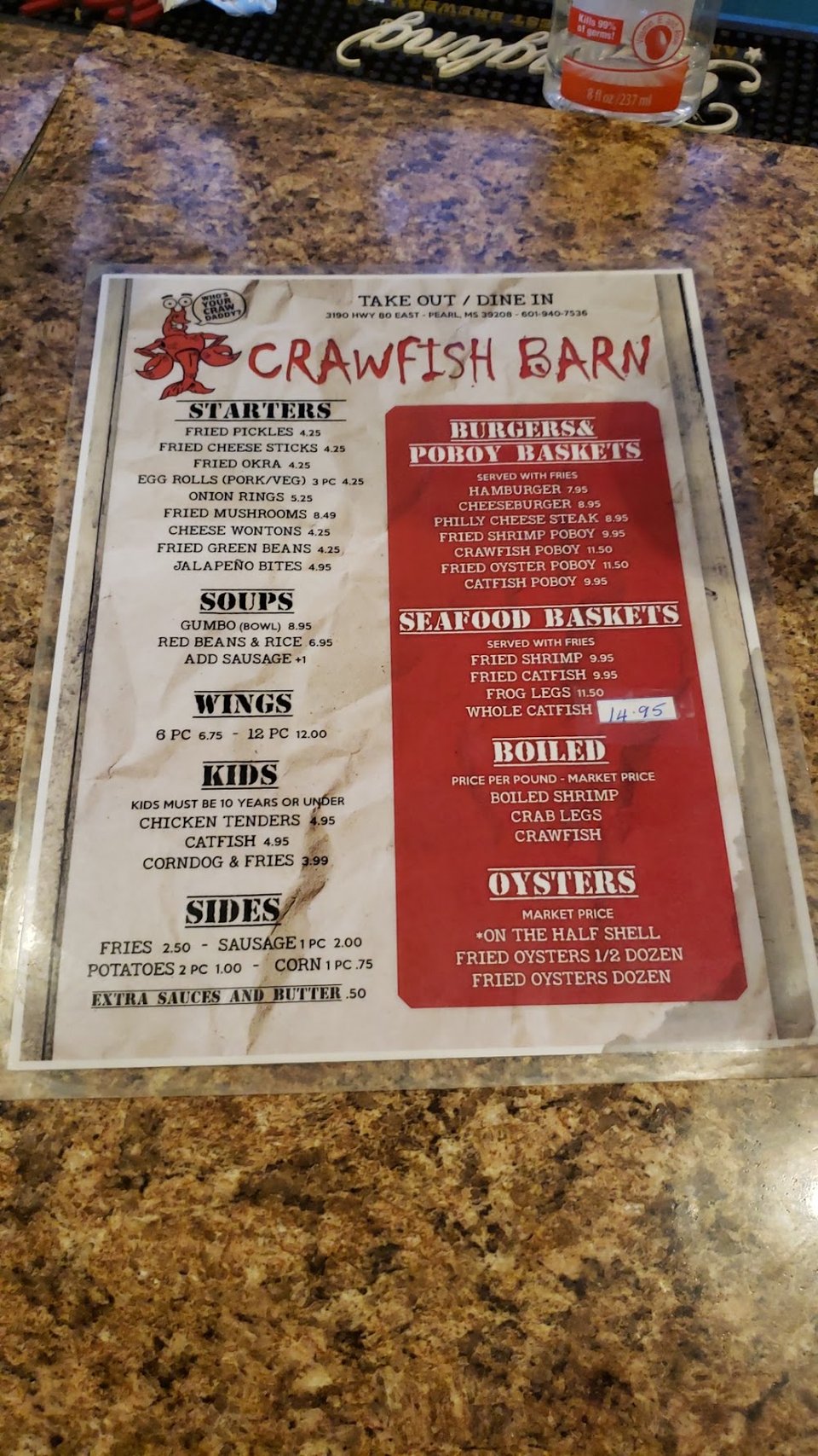 Printed seafood dishes on a restaurant menu.